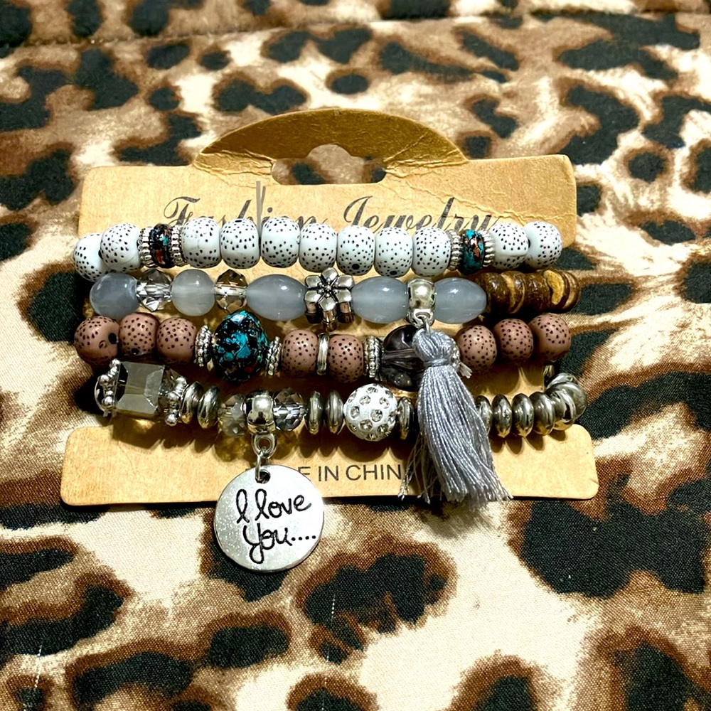 Bracelet- Bohemian wing charm and tassel grey beaded and jade